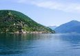 Morcote, il borgo più bello della Svizzera è a 20 minuti da Lugano in battello: parco botanico gratuito, chiesa medievale e pranzo sul lago — ecco quanto si spende davvero